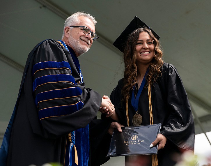 President Robin Baker running with a group of students