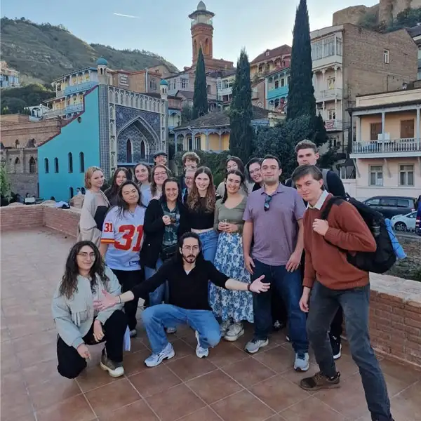 A group of Junior's Abroad students standing for a group photo in Europe