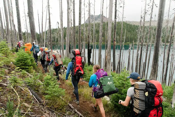 George Fox students hiking through the mountains of Oregon