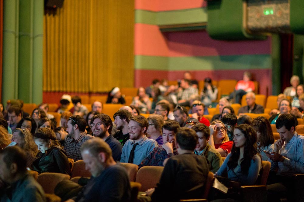 Students sit in a theatre