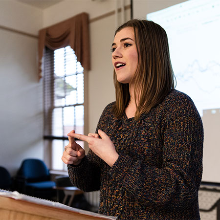 A student doing a presentation during Speech and Debate class