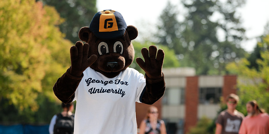 mascot Pennington bear raised arms