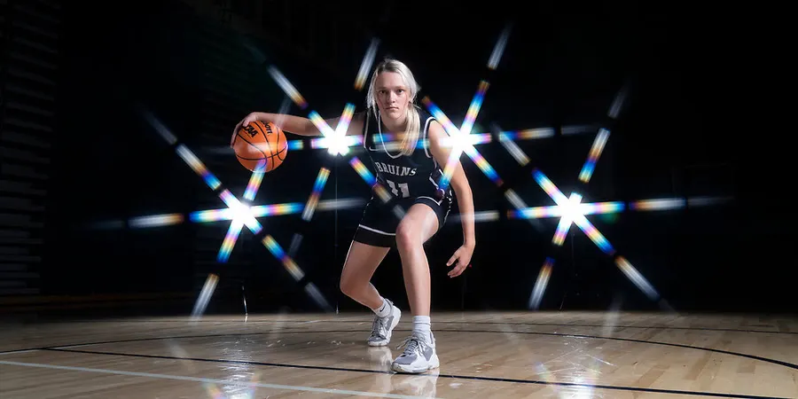  Jenna Lacey dribbles a basketball 