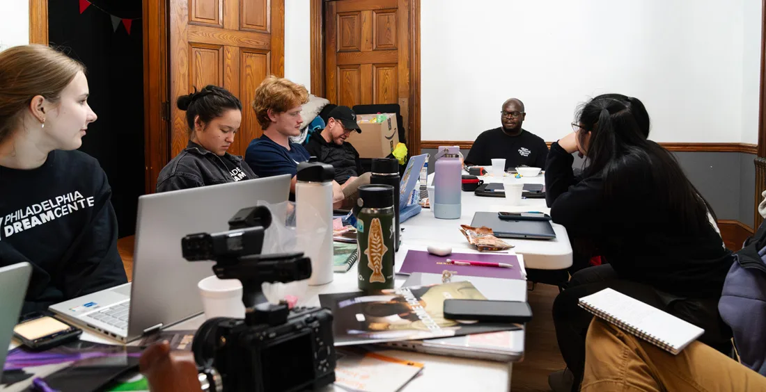 Students brainstorm art projects in a church