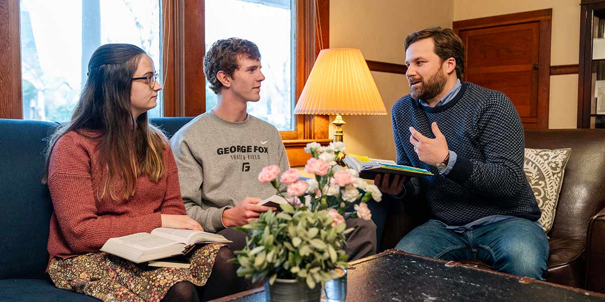 honors students discussing the Bible with faculty