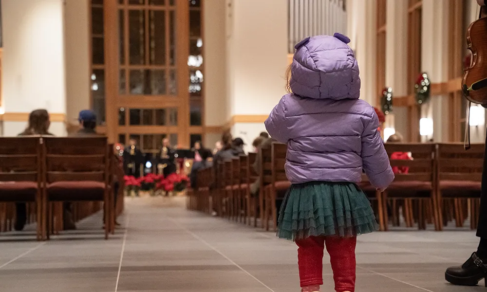 A child in chapel at a Christmas service