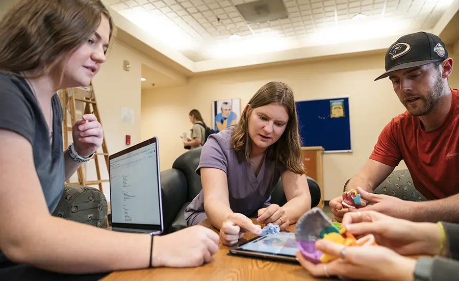 Jordyn working with fellow students