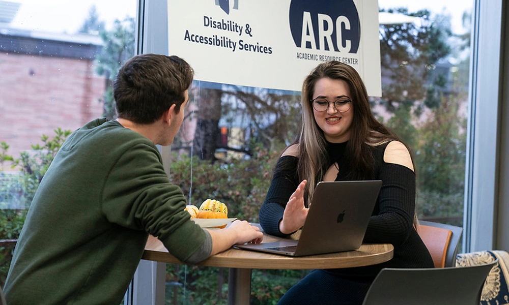 A student and their advisor discussing an assignment at the ARC.