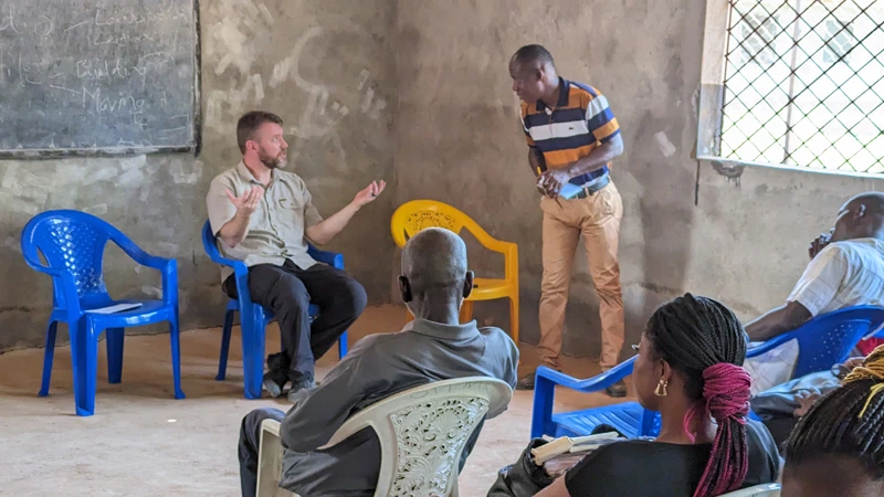 Trevor Owen speaking while on a mission