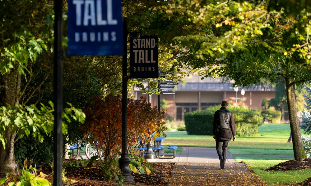 student walking around campus