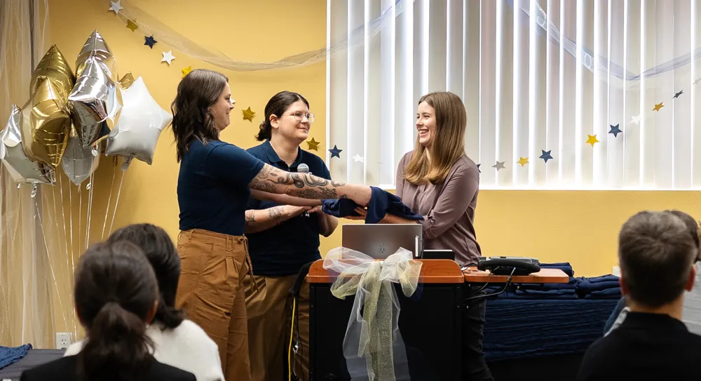 Schroeder is handed an award 