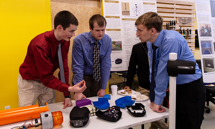 Engineering students preparing for their presentation