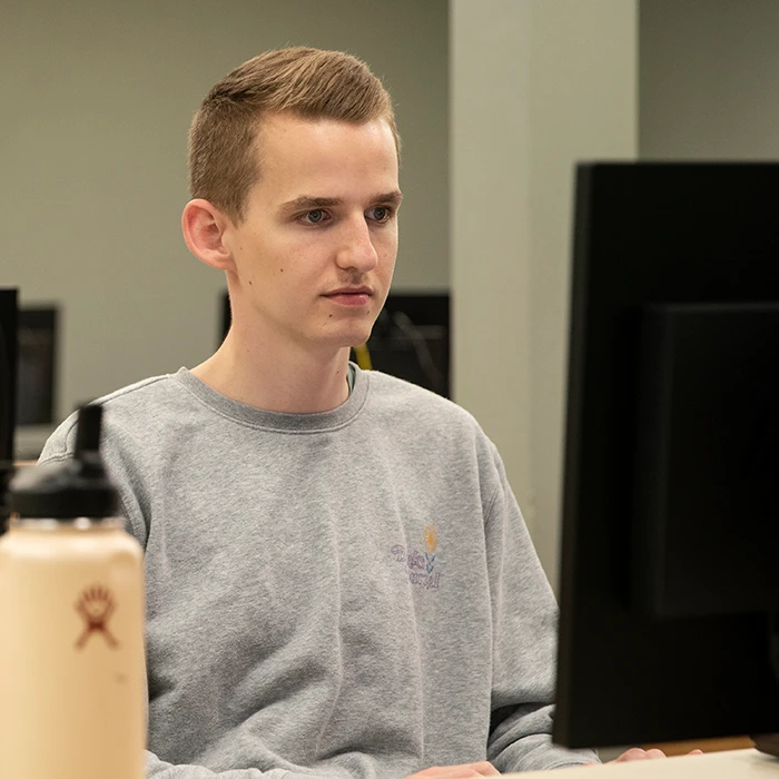 Student doing work on a computer 