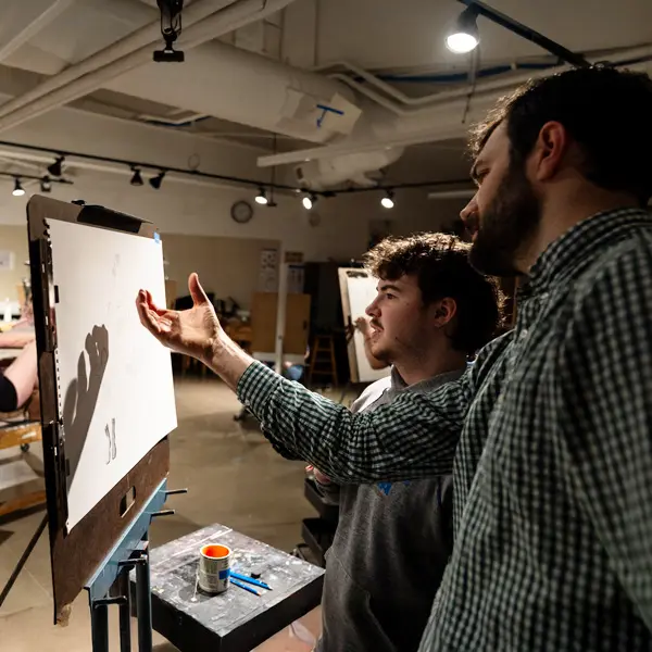 Student gets help from a drawing professor 