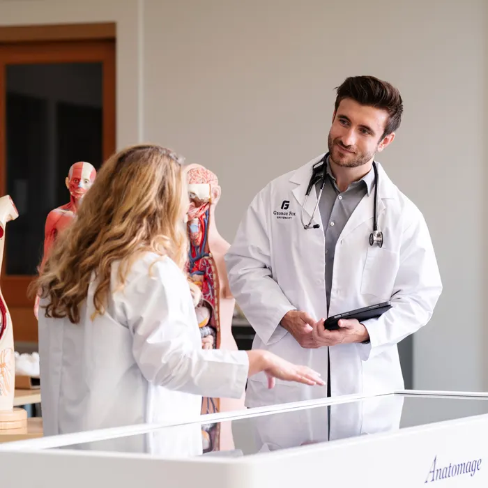 George fox pre-med students in the medical simulation room