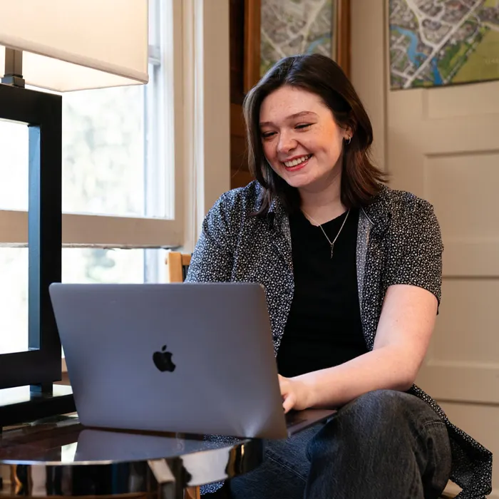 Student works on a laptop