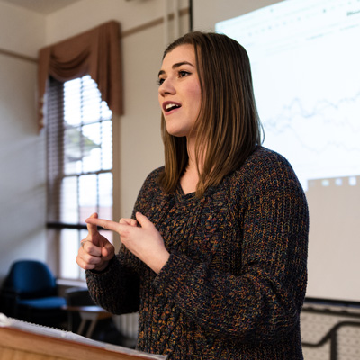 Student at a podium giving a public speech