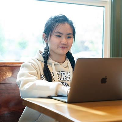 Student studies in a coffee shop