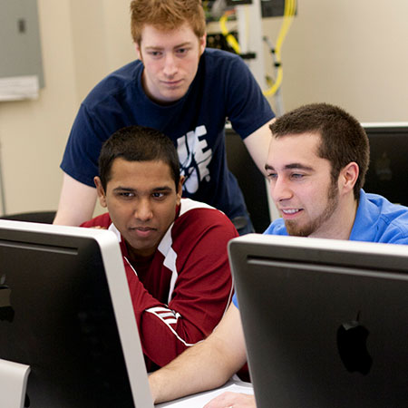 Students studying together in the computer lab