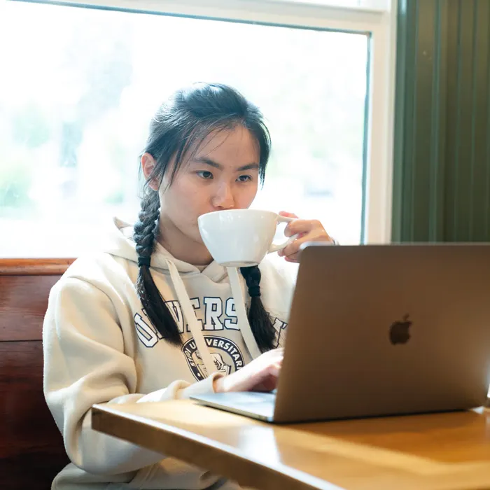 Student works in a coffee shop