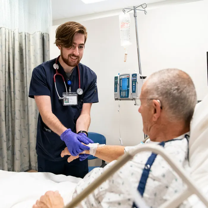 Nursing student with patient