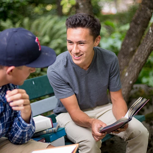 Student studying with another student