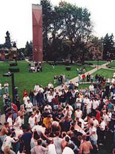 A crowd of students have a dance party on the quad during the bruin brawl