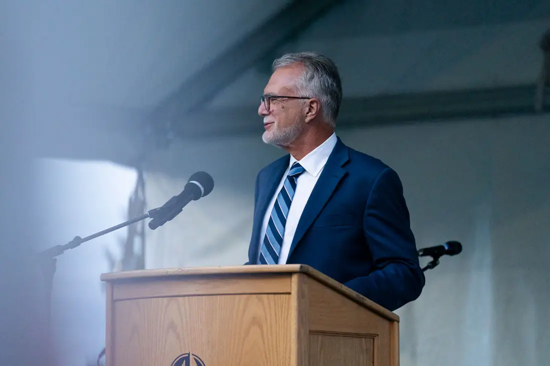 President Robin Baker smiling out at the students during Welcome Ceremony