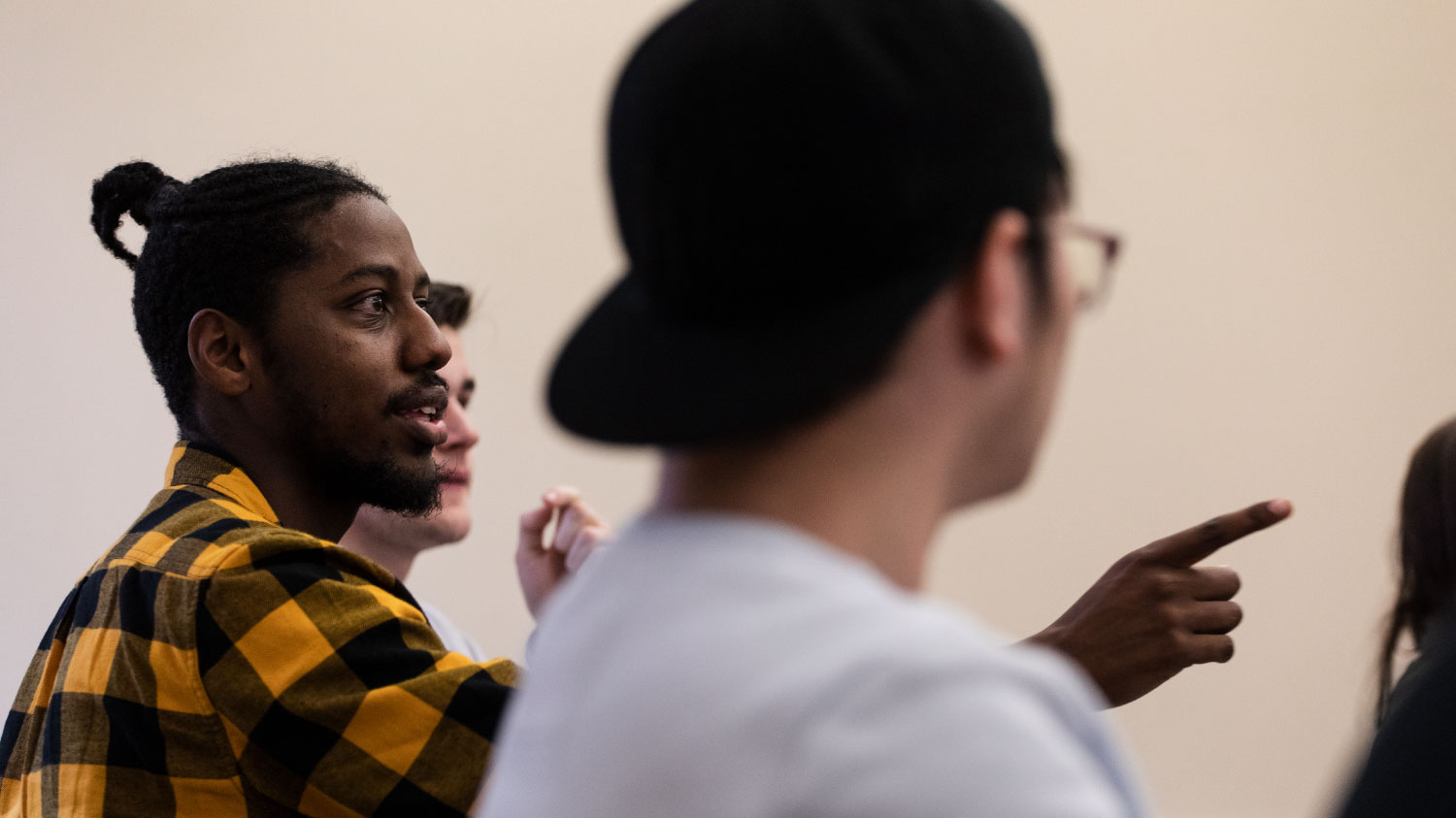 Three students in the LEAD mentor program talking