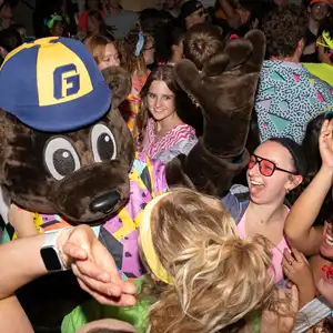 Pennington dancing with students at the 80s dance