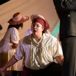 Student wearing glasses looking bewildered and wearing a pirate costume