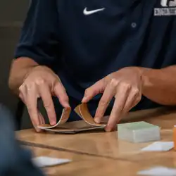 Person shuffling a deck of cards