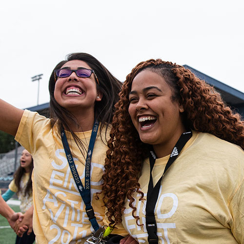 Students cheering in the George Fox stadium