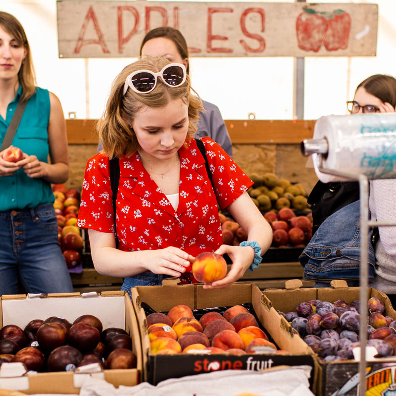 student at the farmers market