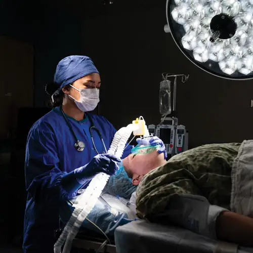 A CRNA student serving a patient