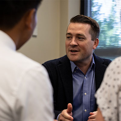 An educator talking with students