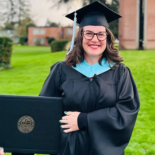 Sarah Goodman poses in cap and gown