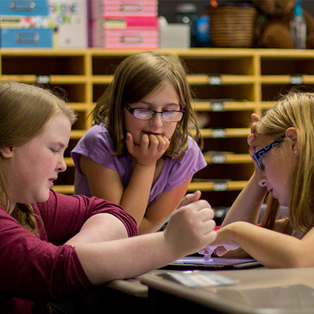 Student Teacher coaching her student in reading