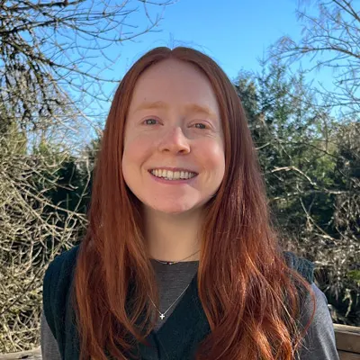 Bethany smiles for a portrait outside