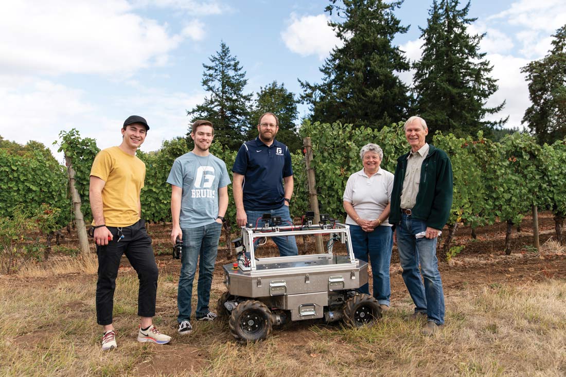 photo of individuals in the vineyard