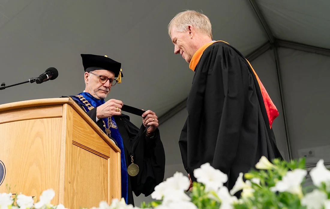 Robin Baker presenting a medal to Neal Ninteman