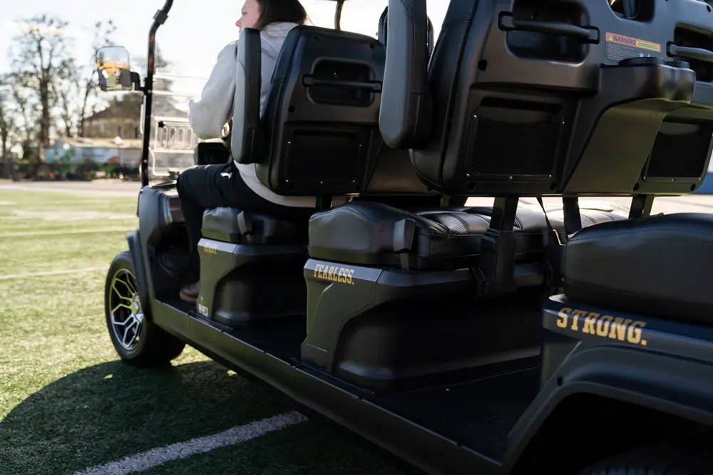 A picture of the gold carts showing the tagline "Ready. Fearless. Strong."