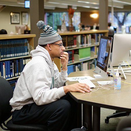 Students using computers at the library commons lab