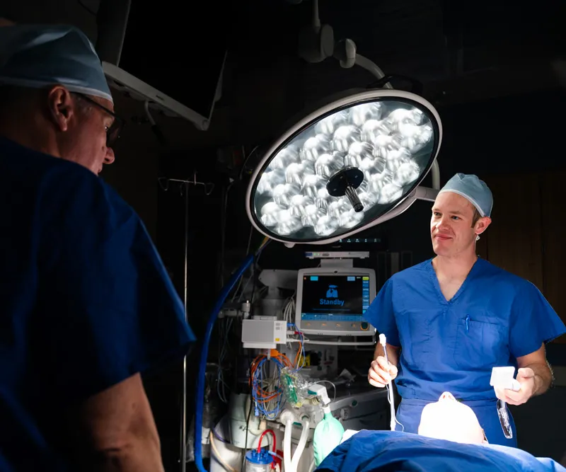 Student helps an older patient