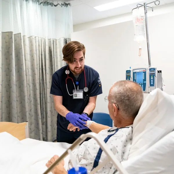 Nurse practitioner smiles with a patient