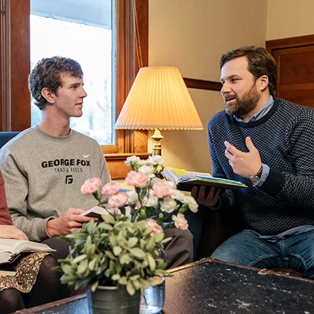 Jay Miller talks with a student