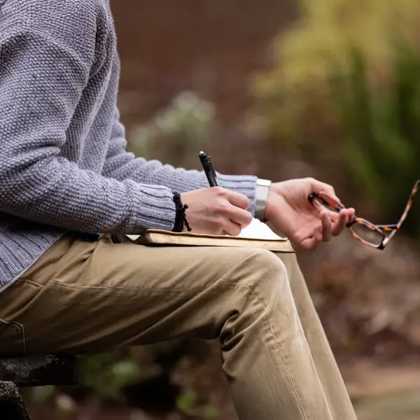 Young employee writes in his bible