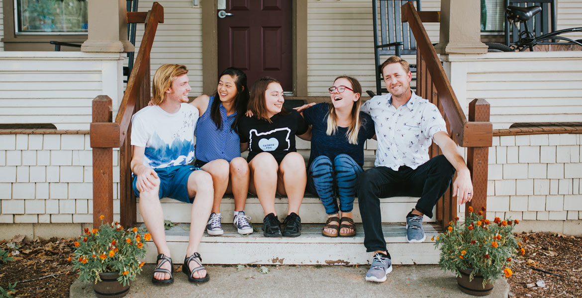 Student sit on a porch