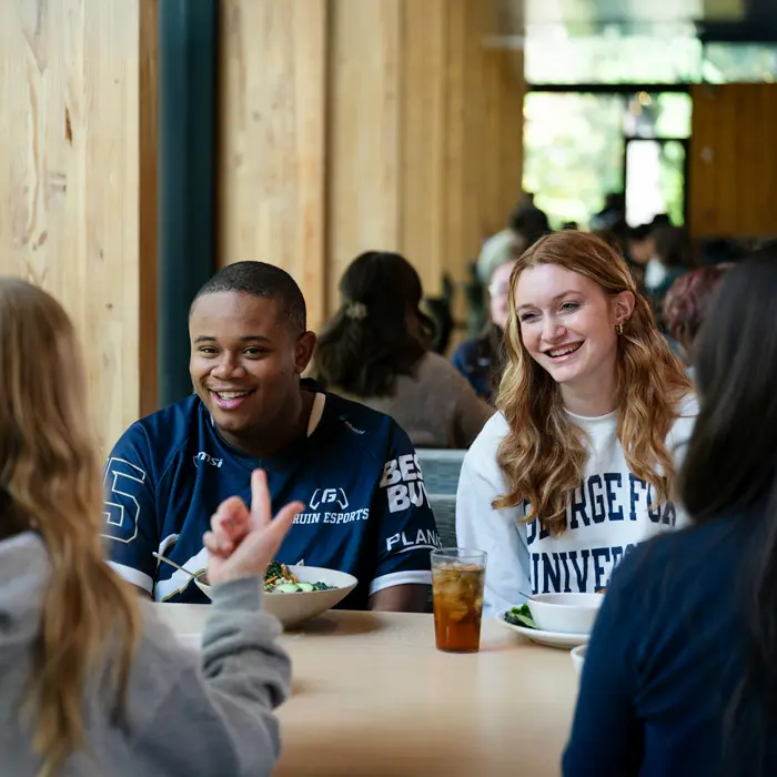 Friends sit together for lunch in Canyon Commons
