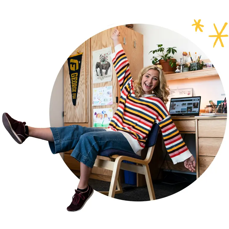 Happy student in her dorm room
